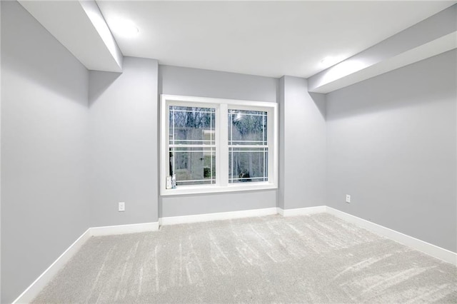 below grade area with carpet flooring and baseboards