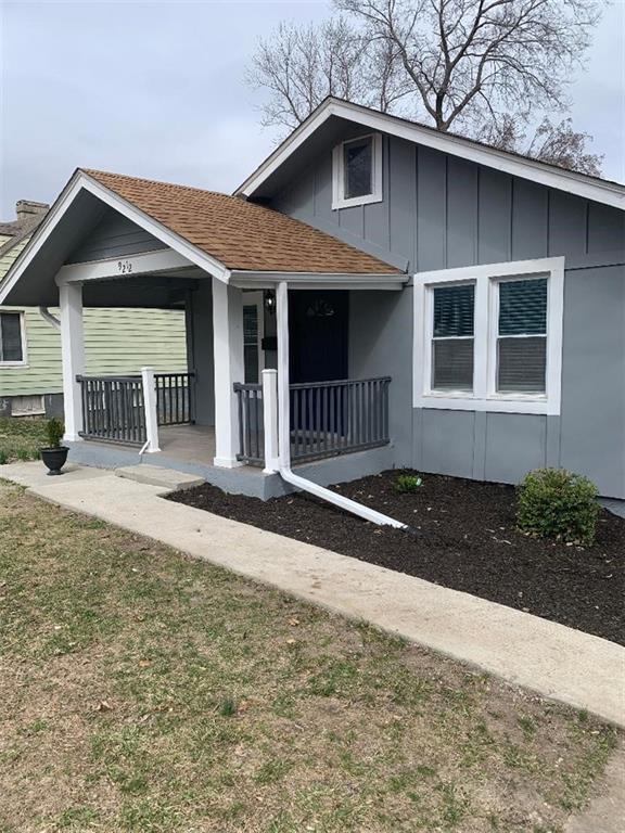 view of front of property featuring board and batten siding, roof with shingles, and a porch