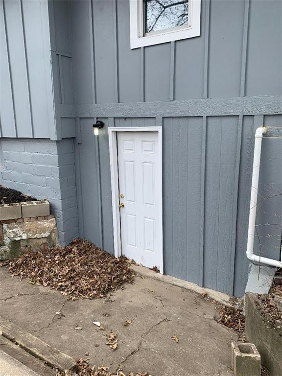 property entrance with board and batten siding