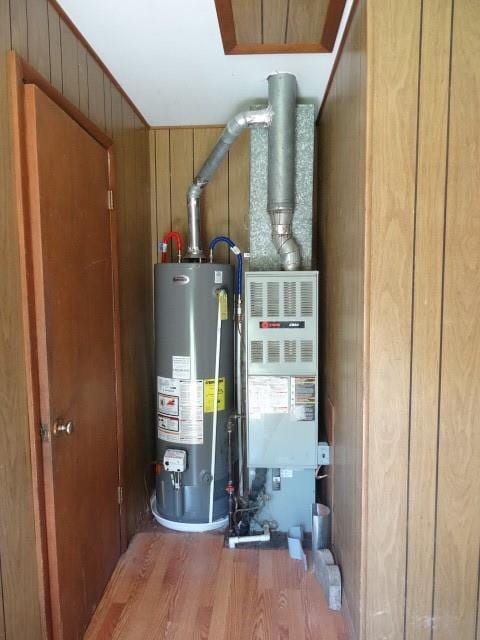 utility room featuring water heater