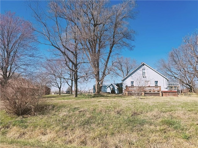 4900 E 219th St, Peculiar, MO 64078 - view of green lawn with a wooden deck