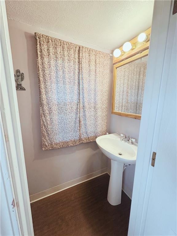 4900 E 219th St, Peculiar, MO 64078 - bathroom featuring wood finished floors and a textured ceiling