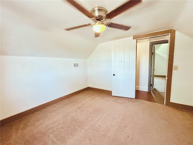 4900 E 219th St, Peculiar, MO 64078 - additional living space with carpet flooring, vaulted ceiling, and a ceiling fan
