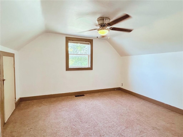 4900 E 219th St, Peculiar, MO 64078 - additional living space featuring light colored carpet, a ceiling fan, and vaulted ceiling