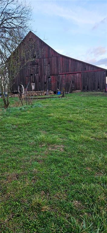 4900 E 219th St, Peculiar, MO 64078 - view of green lawn featuring an outbuilding
