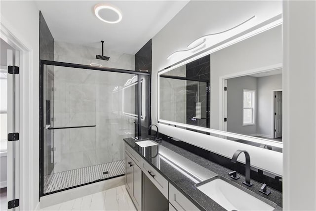 1219 S 36th St, Kansas City, KS 66106 - bathroom featuring a sink, a stall shower, and marble finish floor