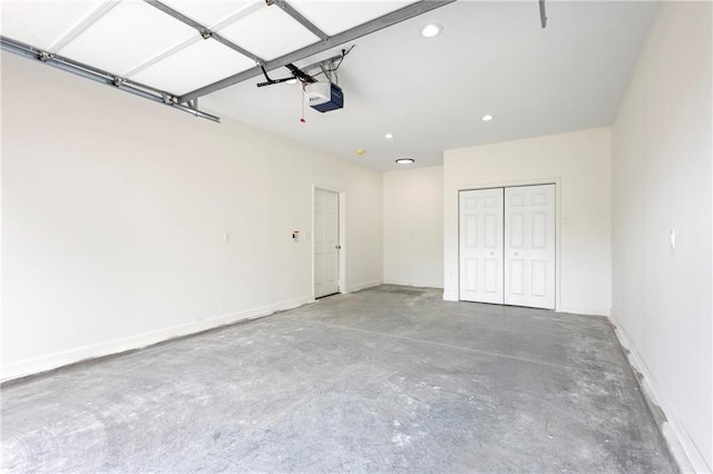 1219 S 36th St, Kansas City, KS 66106 - garage featuring baseboards, recessed lighting, and a garage door opener