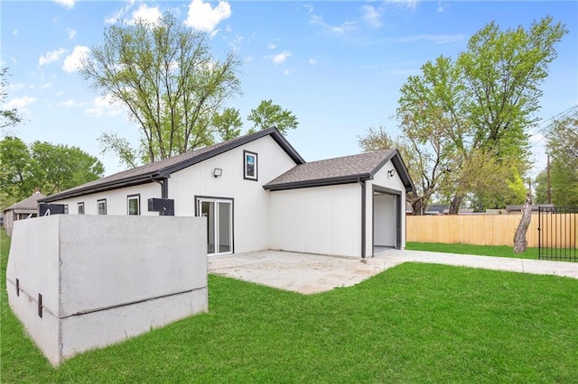 1219 S 36th St, Kansas City, KS 66106 - back of house featuring a patio, fence, and a lawn