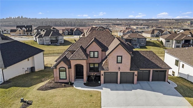 2171 NW Palisades Dr, Riverside, MO 64150 - view of front facade with concrete driveway, a residential view, brick siding, and a garage