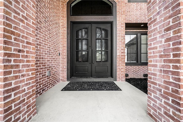 2171 NW Palisades Dr, Riverside, MO 64150 - view of exterior entry with french doors and brick siding