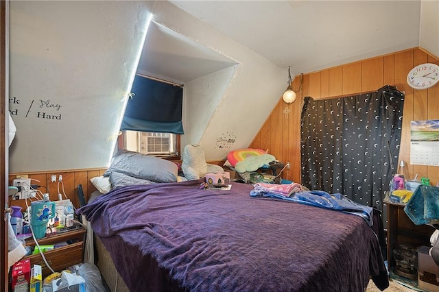 bedroom with cooling unit, wooden walls, and vaulted ceiling