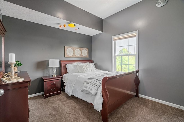 bedroom featuring carpet floors and baseboards