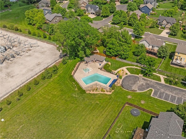 aerial perspective of suburban area featuring a pool