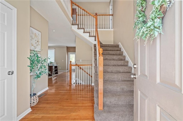 5405 Lakecrest Dr, Shawnee, KS 66218 - entryway with light wood finished floors and stairs