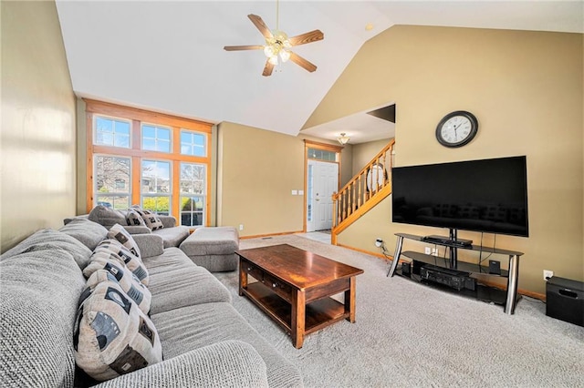 18125 Cypress Bnd, Basehor, KS 66007 - living area featuring high vaulted ceiling, ceiling fan, stairs, carpet flooring, and baseboards