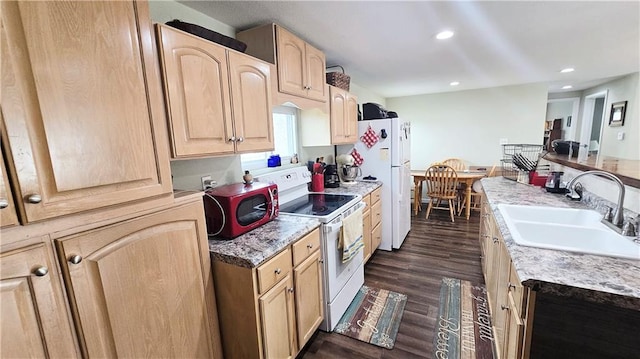 705 Heylman St, Fort Scott, KS 66701 - kitchen featuring dark wood-style floors, white appliances, a sink, and light brown cabinets