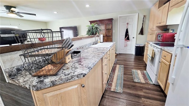 705 Heylman St, Fort Scott, KS 66701 - kitchen featuring white range with electric stovetop, a sink, light brown cabinets, and ceiling fan