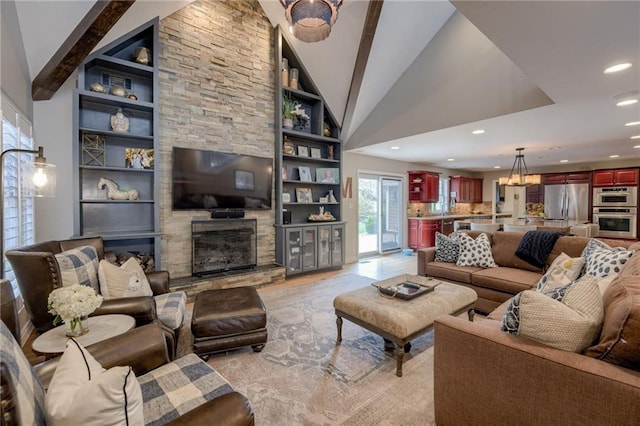 10318 Sagamore Rd, Leawood, KS 66206 - living area with a stone fireplace, vaulted ceiling, recessed lighting, and built in shelves