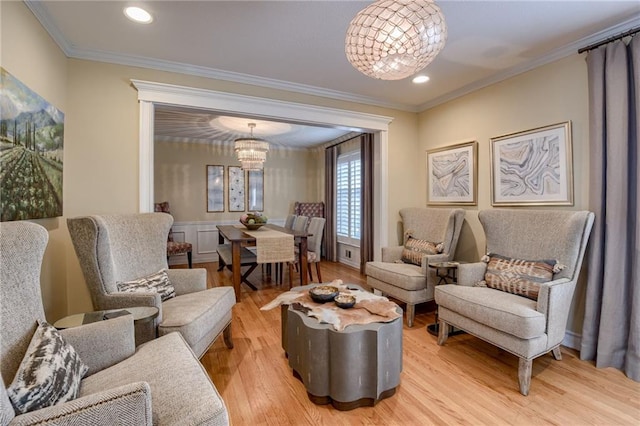 10318 Sagamore Rd, Leawood, KS 66206 - sitting room featuring crown molding, light wood finished floors, a chandelier, and recessed lighting