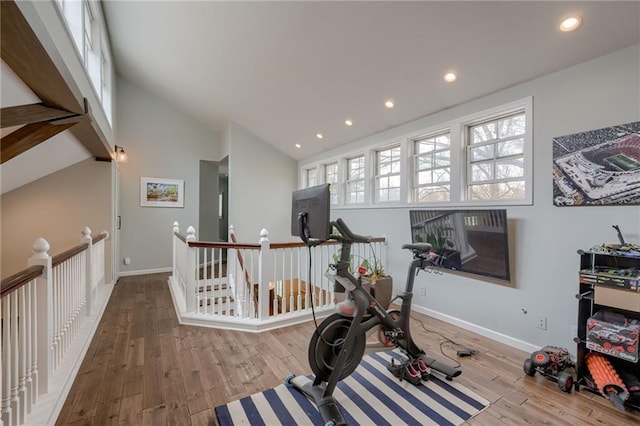 10318 Sagamore Rd, Leawood, KS 66206 - exercise room featuring wood finished floors, recessed lighting, and lofted ceiling