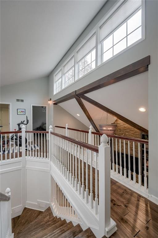 10318 Sagamore Rd, Leawood, KS 66206 - staircase with wood finished floors and high vaulted ceiling