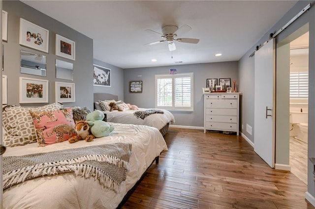 10318 Sagamore Rd, Leawood, KS 66206 - bedroom with hardwood / wood-style flooring, a barn door, recessed lighting, and a ceiling fan