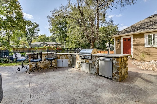 10318 Sagamore Rd, Leawood, KS 66206 - view of patio / terrace featuring exterior kitchen