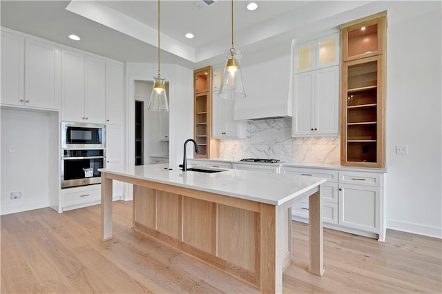 24936 W 98th Pl, Lenexa, KS 66227 - kitchen featuring appliances with stainless steel finishes, recessed lighting, light wood-type flooring, backsplash, and light countertops