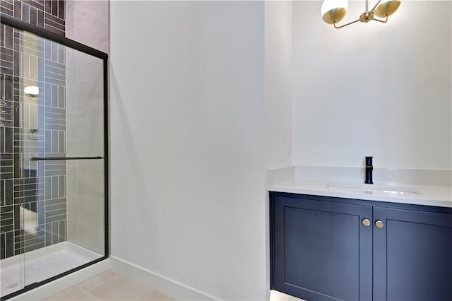 24936 W 98th Pl, Lenexa, KS 66227 - full bathroom featuring a stall shower, vanity, a chandelier, and tile patterned flooring