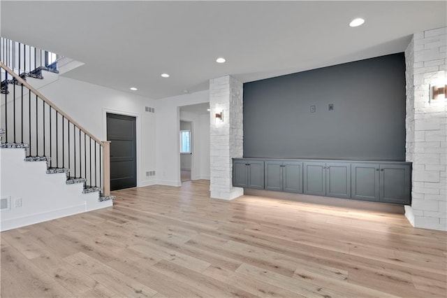 24936 W 98th Pl, Lenexa, KS 66227 - unfurnished living room featuring stairs, light wood-style flooring, and recessed lighting