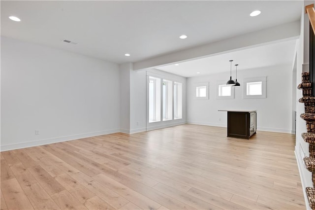 24936 W 98th Pl, Lenexa, KS 66227 - unfurnished living room featuring light wood-style floors and recessed lighting