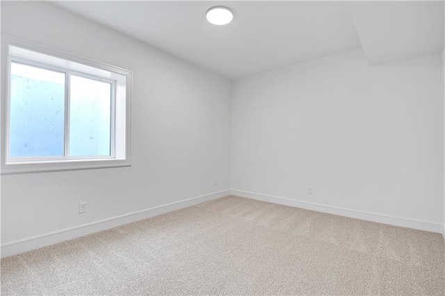24936 W 98th Pl, Lenexa, KS 66227 - spare room featuring light carpet and baseboards