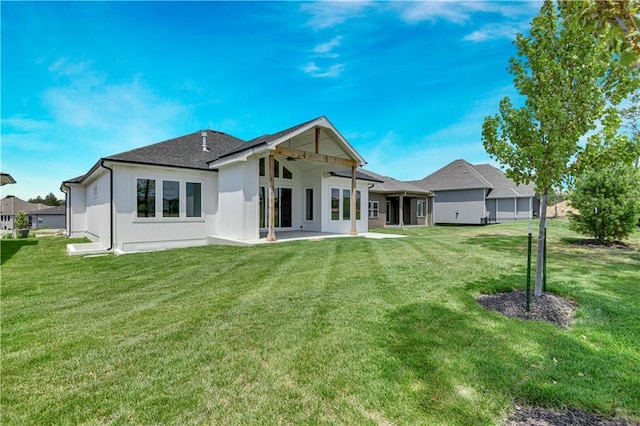 24936 W 98th Pl, Lenexa, KS 66227 - back of house with a yard and roof with shingles