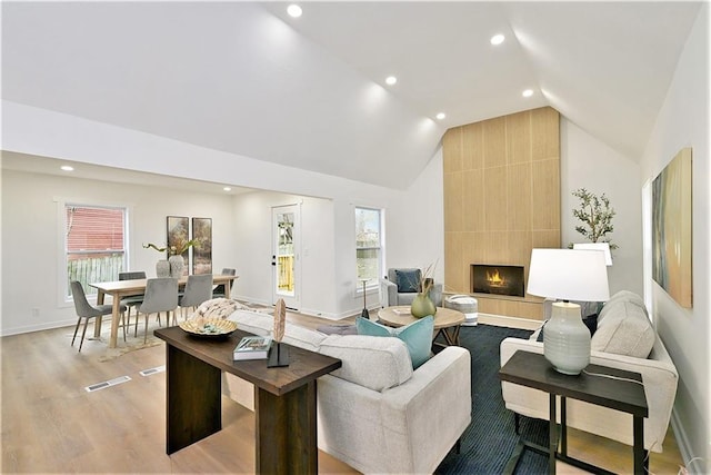 1209 S Lennox Dr, Olathe, KS 66062 - living room featuring visible vents, recessed lighting, plenty of natural light, and lofted ceiling
