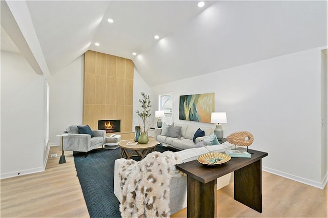1209 S Lennox Dr, Olathe, KS 66062 - living room featuring light wood-style floors, baseboards, and lofted ceiling