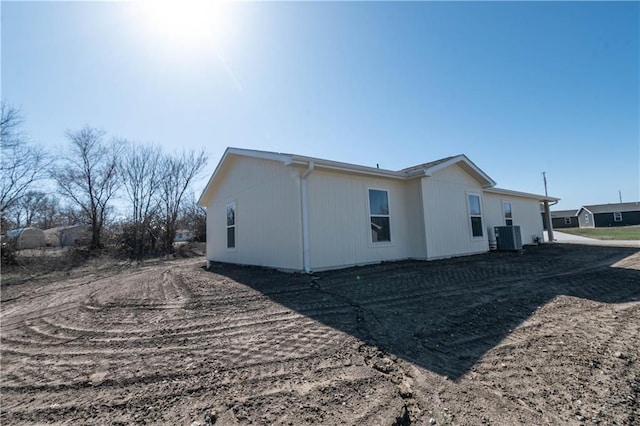 1702 N 2nd St, Neodesha, KS 66757 - view of home's exterior with central AC unit