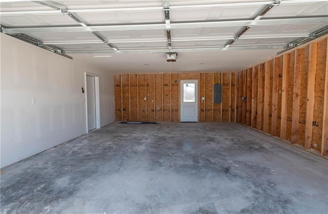 1702 N 2nd St, Neodesha, KS 66757 - garage with electric panel and a garage door opener