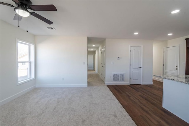 1702 N 2nd St, Neodesha, KS 66757 - unfurnished room featuring baseboards, visible vents, and ceiling fan