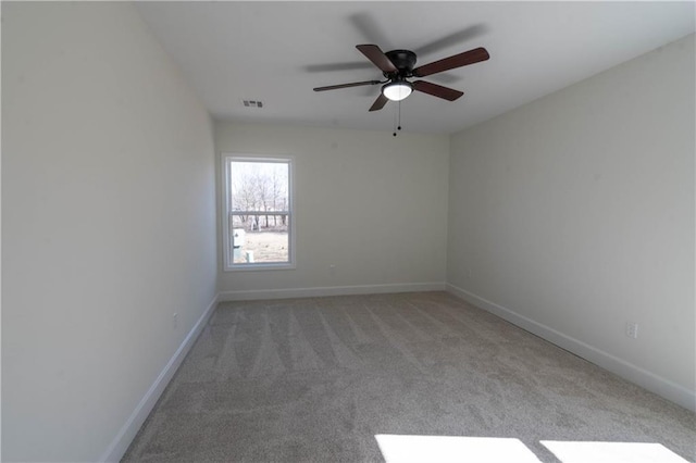 1702 N 2nd St, Neodesha, KS 66757 - carpeted empty room with visible vents, baseboards, and ceiling fan