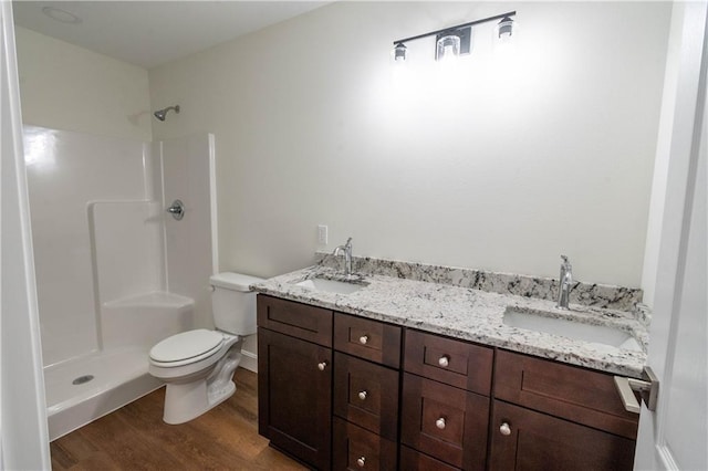 1702 N 2nd St, Neodesha, KS 66757 - full bath with wood finished floors, a shower, and a sink