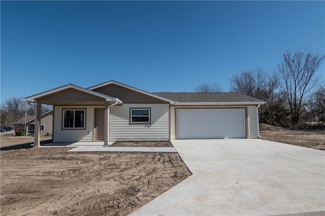 1702 N 2nd St, Neodesha, KS 66757 - ranch-style home with concrete driveway and an attached garage