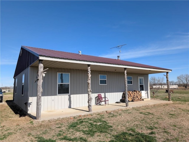rear view of house with metal roof