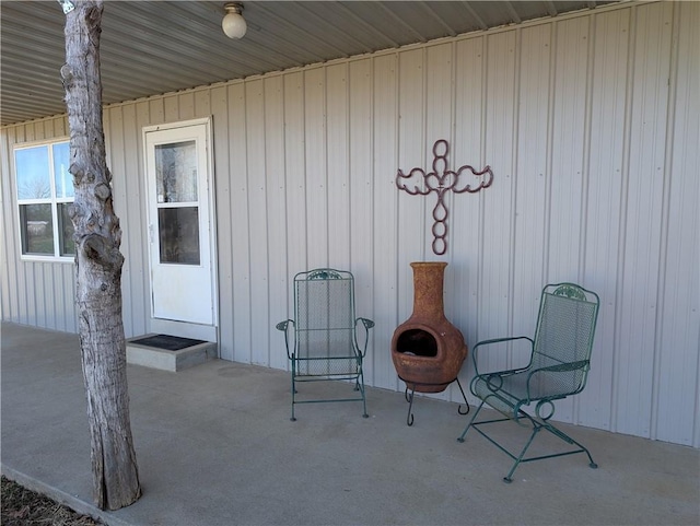 doorway to property featuring board and batten siding