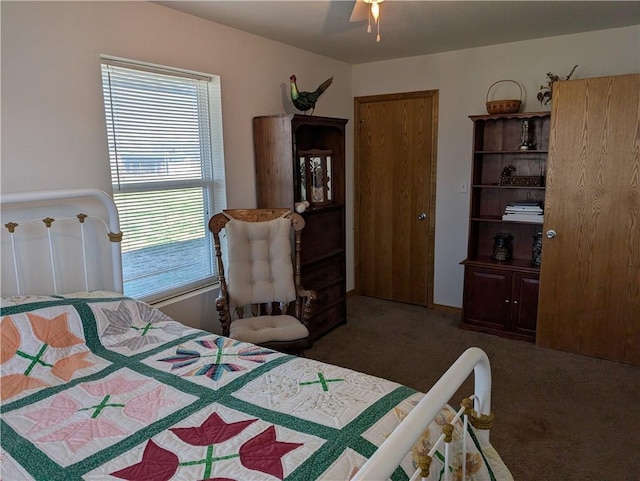 carpeted bedroom featuring a ceiling fan