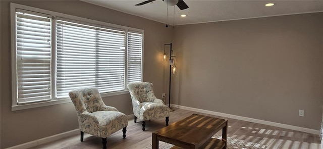 living area featuring recessed lighting, baseboards, wood finished floors, and a ceiling fan