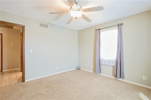 3402 Messanie St, Saint Joseph, MO 64501 - unfurnished room featuring carpet flooring, ceiling fan, baseboards, and a textured ceiling