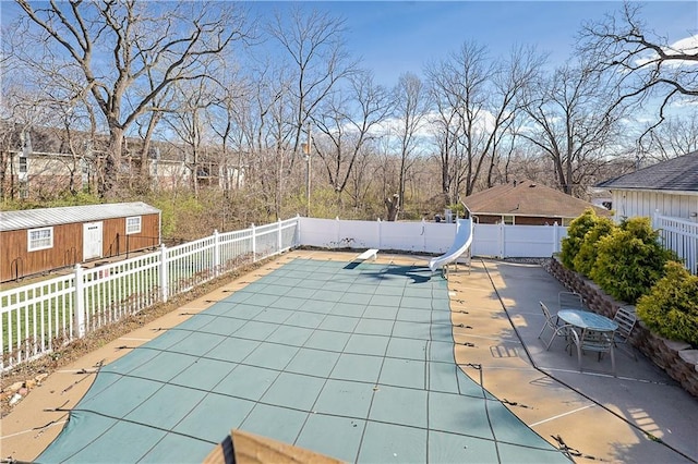 3402 Messanie St, Saint Joseph, MO 64501 - view of swimming pool featuring a water slide, a fenced backyard, and a patio area
