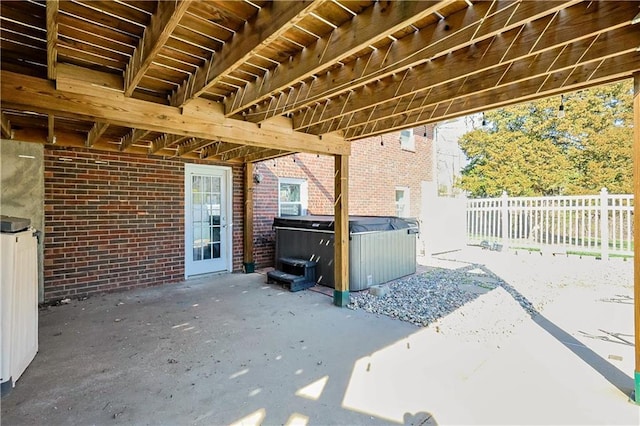 3402 Messanie St, Saint Joseph, MO 64501 - view of patio featuring a hot tub and fence