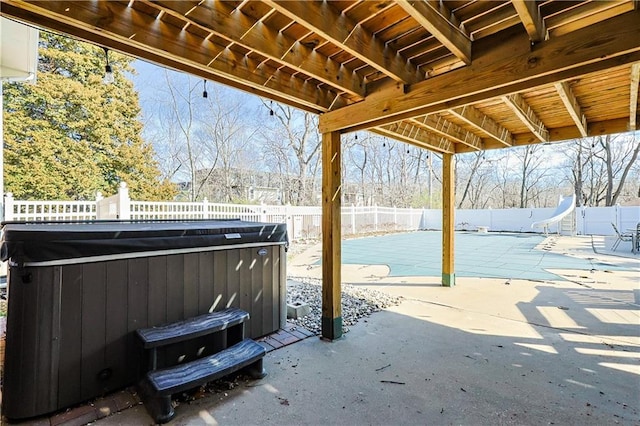 3402 Messanie St, Saint Joseph, MO 64501 - view of patio / terrace featuring a hot tub and a fenced backyard