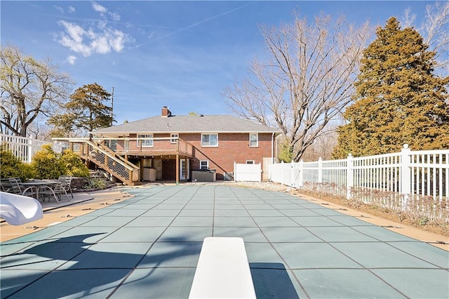 3402 Messanie St, Saint Joseph, MO 64501 - view of swimming pool featuring stairs, a fenced backyard, a deck, a patio, and a diving board